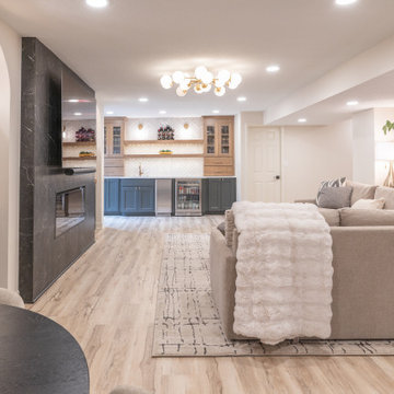 Warm & Inviting Basement Retreat with Custom Bar + Entertainment Center
