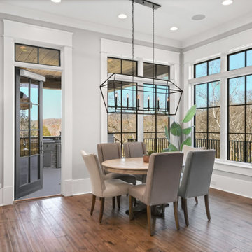 Transitional Dining & Living Room with Vaulted Beams and Stone Fireplace
