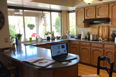 Large transitional medium tone wood floor and brown floor eat-in kitchen photo in Phoenix with an undermount sink, shaker cabinets, medium tone wood cabinets, quartz countertops, stainless steel appliances, an island and beige countertops