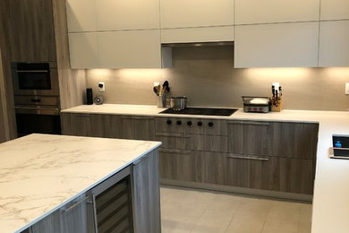 This is an example of a large modern kitchen in New York.