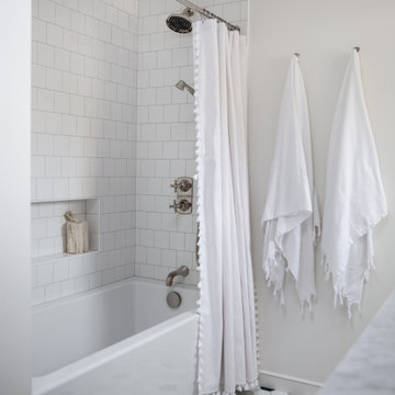 White Ceramic Tile Tub Surround and Hex Tiles