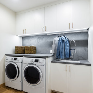 Laundry Room with Utility Sink, Pull-Down Sprayer Faucet, and Drying Rod