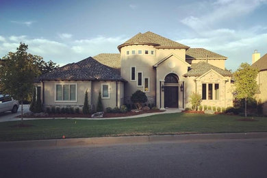 Large mountain style beige two-story mixed siding exterior home photo in Other with a hip roof