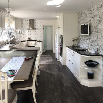 White Kitchen with Black Granite Countertops