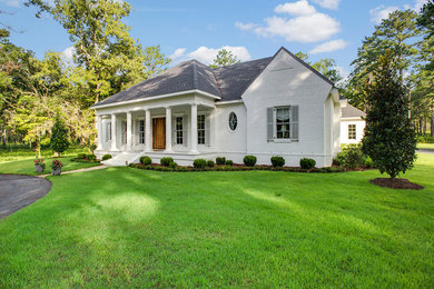 Inspiration for a timeless white brick house exterior remodel in Other