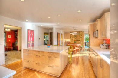 Kitchen - contemporary kitchen idea in Other with red backsplash and an island