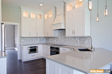 Large trendy eat-in kitchen photo in Jacksonville with a single-bowl sink, shaker cabinets, white cabinets, quartz countertops, gray backsplash, mosaic tile backsplash, stainless steel appliances and gray countertops
