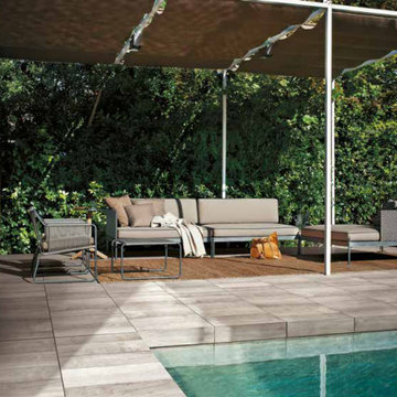 Contemporary pool with grey stone look pool tile