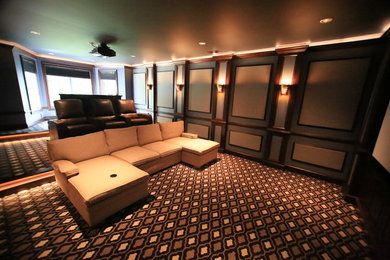 Example of a mid-sized trendy enclosed carpeted home theater design in Baltimore with multicolored walls and a projector screen