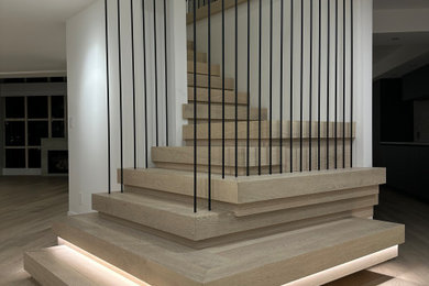 Inspiration for a huge contemporary wooden floating metal railing staircase remodel in Vancouver with wooden risers