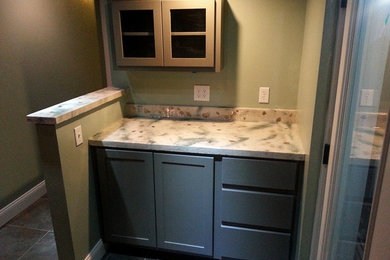 Photo of a mid-sized home bar in Other.