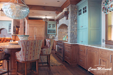 Open concept kitchen - large transitional l-shaped dark wood floor, brown floor and exposed beam open concept kitchen idea in New York with a farmhouse sink, raised-panel cabinets, blue cabinets, quartz countertops, stainless steel appliances, an island and beige countertops