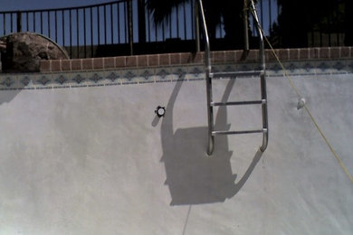 Large backyard rectangular pool photo in Phoenix