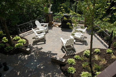 Design ideas for a huge traditional partial sun hillside stone outdoor basketball/tennis/multi-game court in Minneapolis for summer.