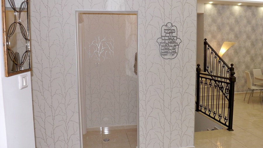 view from the kitchen: doorway into guest bathroom