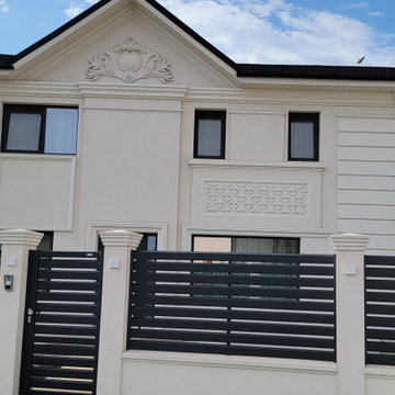 Pediment and upper-floor windows with their profiled surroun