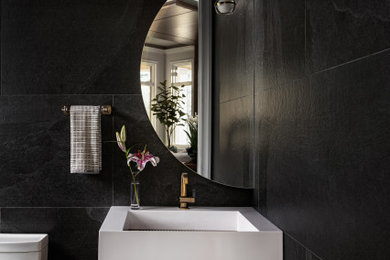 Example of a trendy powder room design in Raleigh