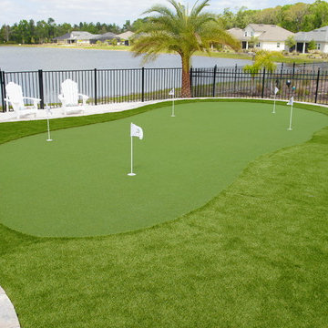 Back Yard Paradise: Paver, Fire-pit, Custom Golf course, Outdoor kitchen.