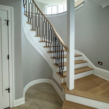 Project #95 | Freestanding Elliptical Staircase with Geometric Iron Balusters