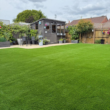 Artificial Lawn Up to a Garden Room and Seating Area