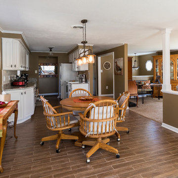 Looking from sunroom into dining and living area of existing home