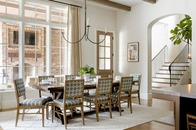 Example of a transitional light wood floor dining room design in Dallas with beige walls