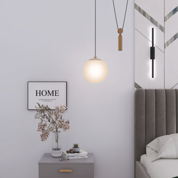 Small Bedroom Nightstand with Sculptural Pendant Lighting