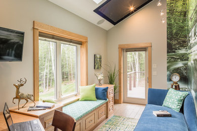 Study room - transitional built-in desk light wood floor study room idea in Portland Maine with multicolored walls