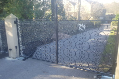 Scrolled wrought iron estate gates