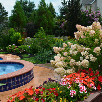 Raised garden beds at deck overlooking hot tub