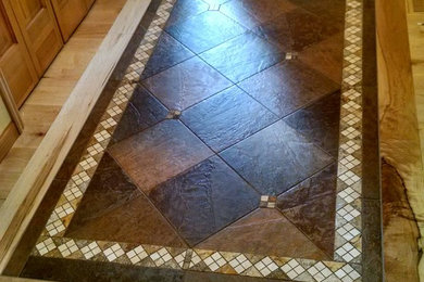 Foyer - mid-sized traditional light wood floor foyer idea in Minneapolis