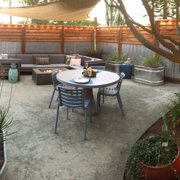 Corner view with plantings, planters, dining and seating. (Modern Industrial)