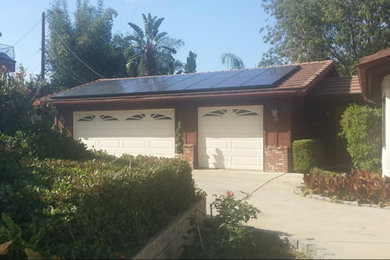 Inspiration for a mid-sized transitional brown one-story mixed siding exterior home remodel in Austin with a shingle roof