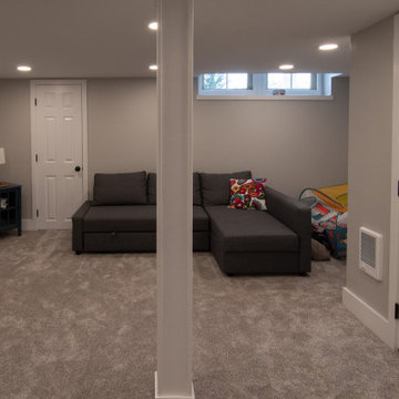 Bathroom/Laundry Room Using Warmer Tones, Accented by New Laundry Facility