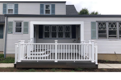 Deck - small traditional backyard deck idea in Other with a roof extension