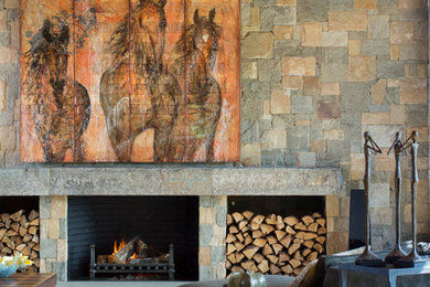 Inspiration for a mid-sized modern open concept medium tone wood floor and brown floor family room remodel in Miami with multicolored walls, a standard fireplace, a stone fireplace and a concealed tv