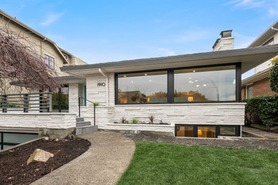 Example of a 1950s exterior home design in Seattle