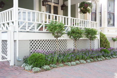 Design ideas for a mid-sized traditional side yard partial sun garden in Boston with a garden path and brick pavers.