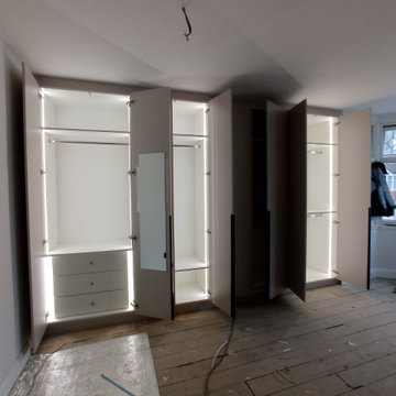Modern Hinged Wardrobe with Backlights in Stanmore by Kudos Interior Designs