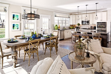 Beach style medium tone wood floor great room photo in DC Metro with beige walls