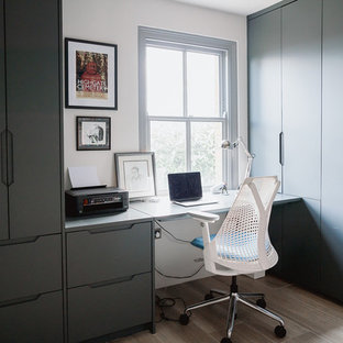 Design ideas for a modern home office and library in London.