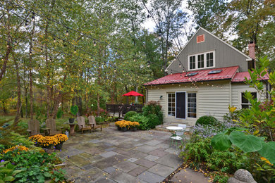 Inspiration for a mid-sized country backyard patio in New York with concrete pavers and no cover.