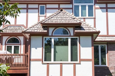Inspiration for a white two-story mixed siding exterior home remodel in Wichita