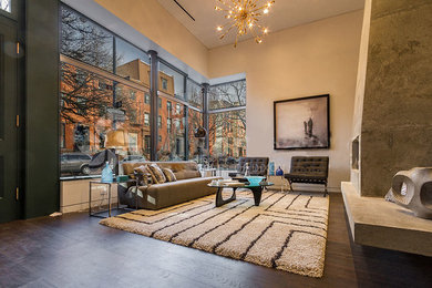 Example of a mid-sized danish open concept dark wood floor and brown floor living room design in New York with beige walls