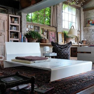 Inspiration for a large contemporary loft-style bedroom remodel in Miami with beige walls