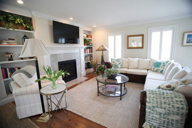 Example of a transitional open concept living room design in Boston with a standard fireplace and a stone fireplace