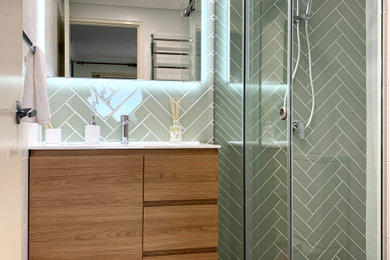 Photo of a mid-sized contemporary bathroom in Sydney with medium wood cabinets, a corner shower, white walls, an integrated sink, grey floor, a sliding shower screen, white benchtops, a single vanity and a freestanding vanity.