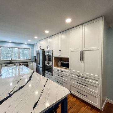 Kitchen with White Perimeter and Blue Island Cabinet Reface