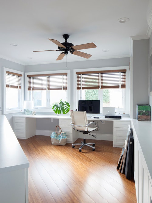 Modern Home Office Hawaii Example of an island style home office design in Hawaii with gray walls, medium tone
