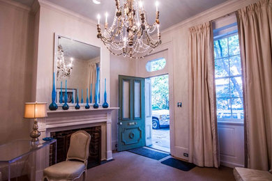Inspiration for an eclectic formal and enclosed light wood floor living room remodel in New Orleans with a standard fireplace, a brick fireplace and beige walls